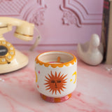 A Dopo 8 oz Handpainted Sun Ceramic Candle-  Orange Blossom